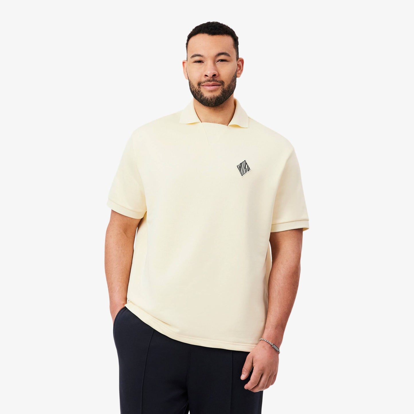 Polo molletonné ample à écusson