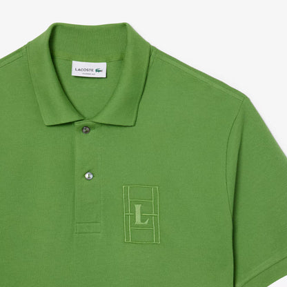 Polo en petit piqué avec broderies, coupe classique