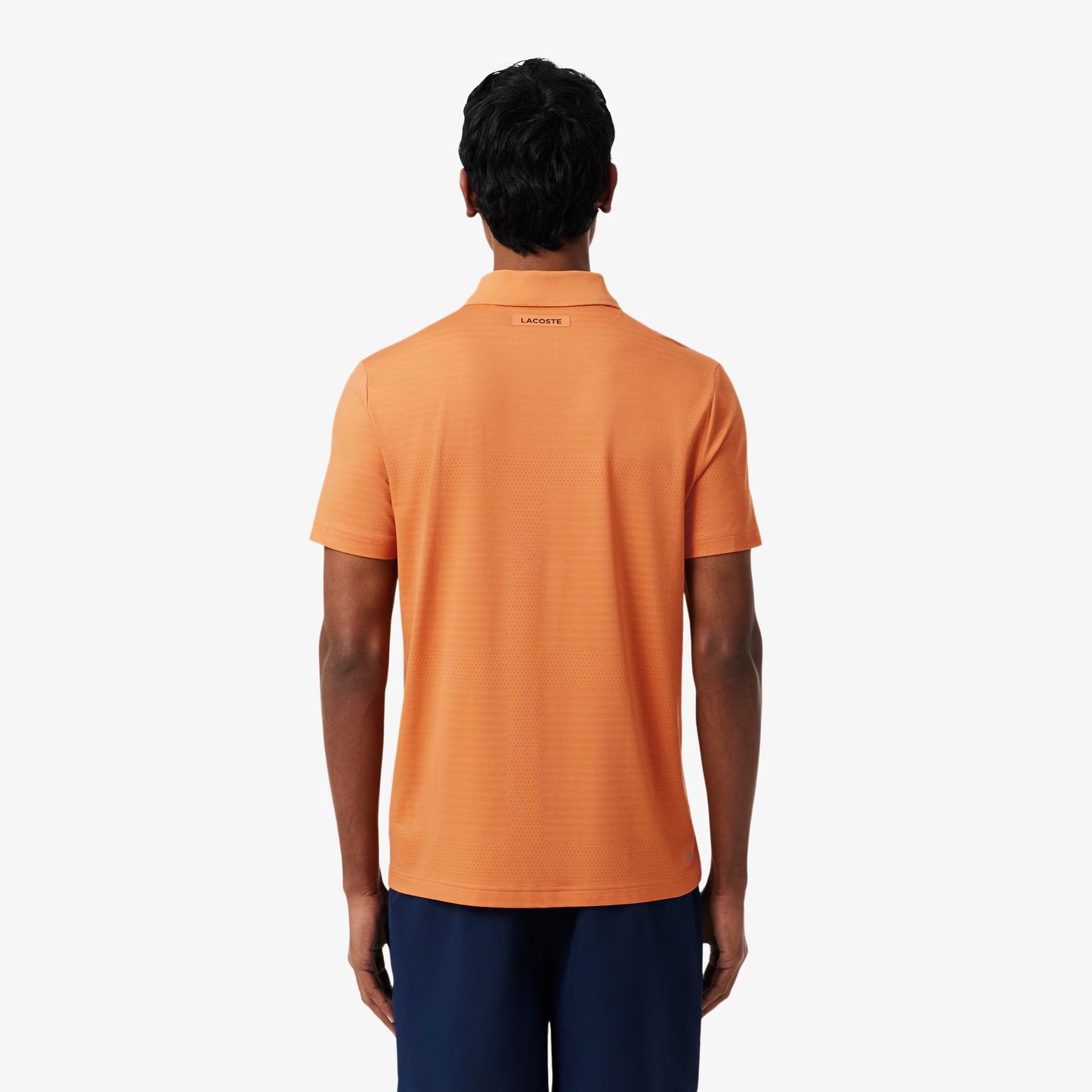 Polo de tennis en jacquard stretch ultra-respirant