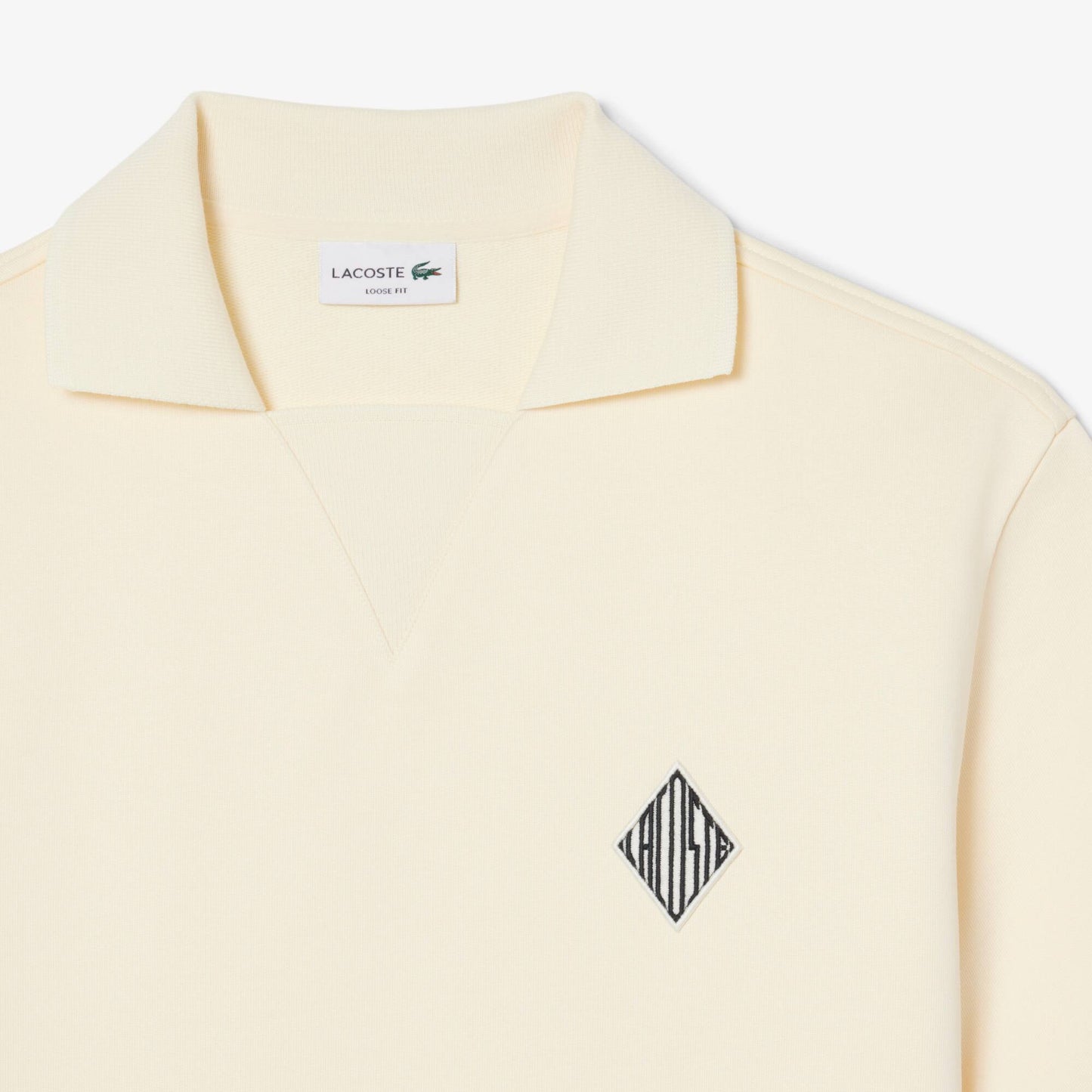 Polo molletonné ample à écusson