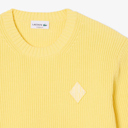 Pull en tricot côtelé perlé avec badge