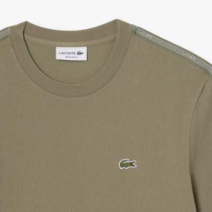 T-shirt à bande rayée griffée
