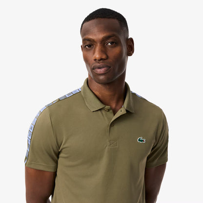 Polo de tennis à rayures Ultra Dry de marque